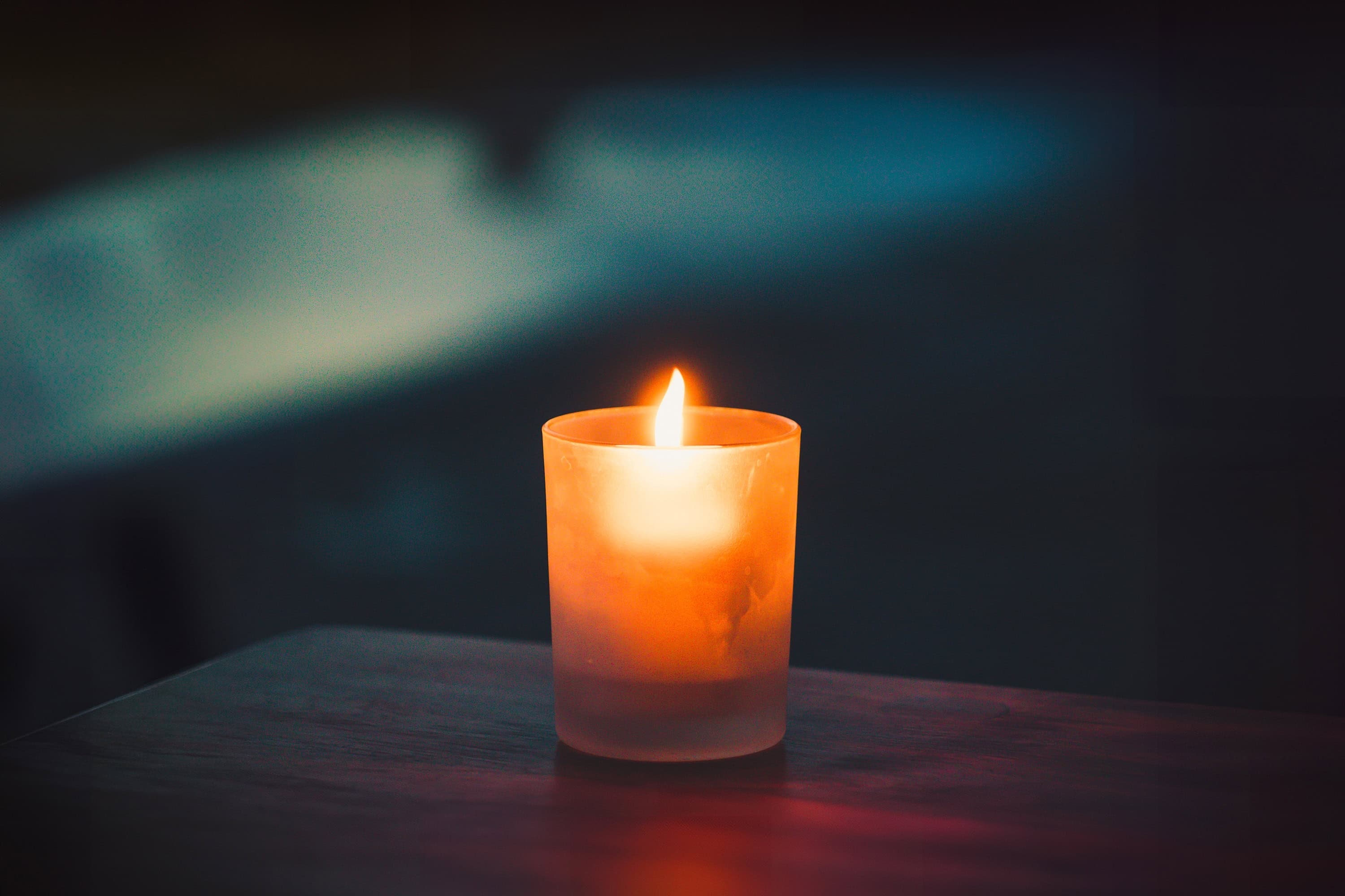 Soft candlelight — a calm setting for writing an obituary and honoring a loved one